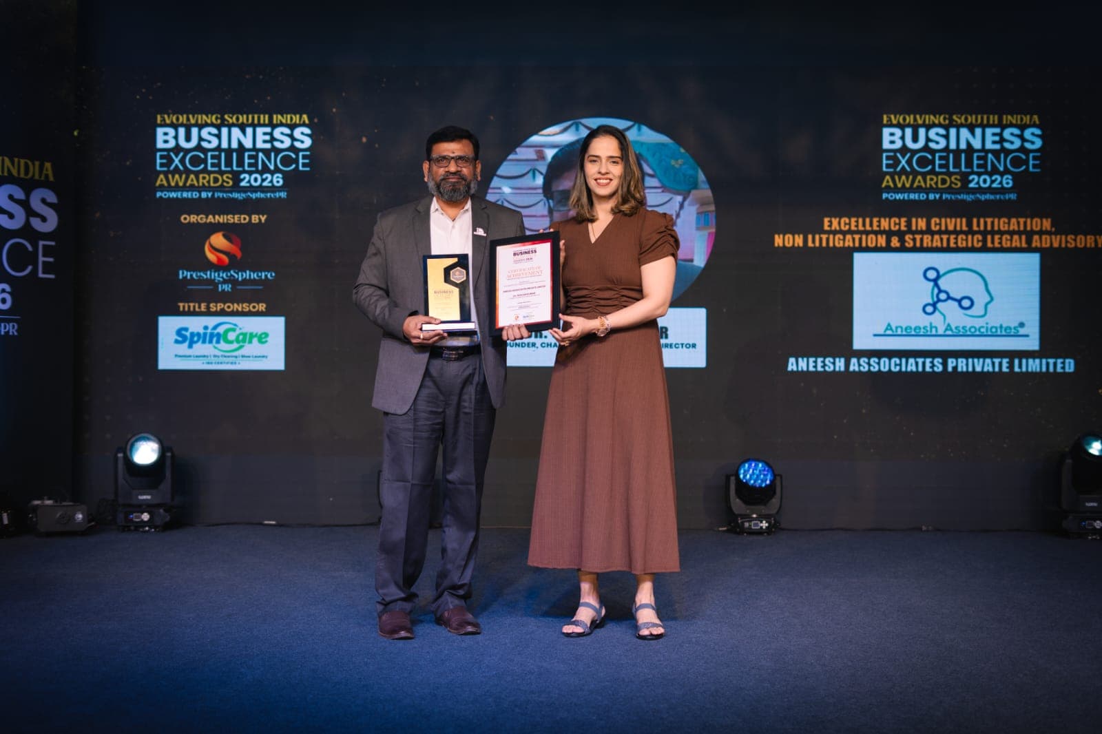 Business Excellence Award 2026 — Dr. Sravan Kumar D receiving the award on stage